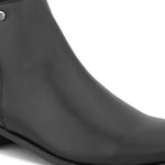 A sleek black leather Chelsea boot with a side zipper, pull-tab at the back, and a low block heel.
