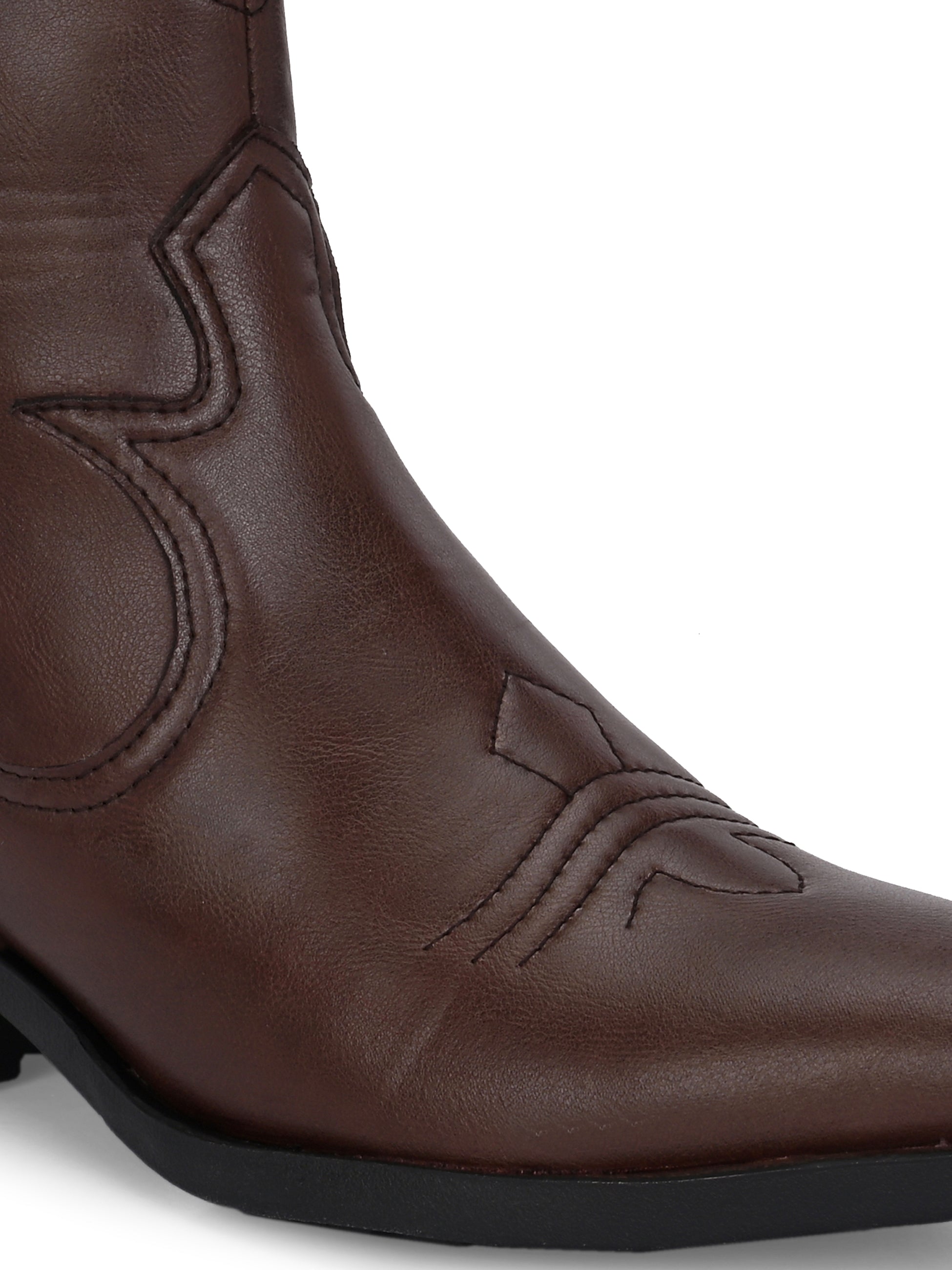 Brown ankle boots with intricate decorative stitching, featuring a slip-on design.