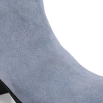 Light blue heigh top boot with a block heel and a sleek, minimalist design.