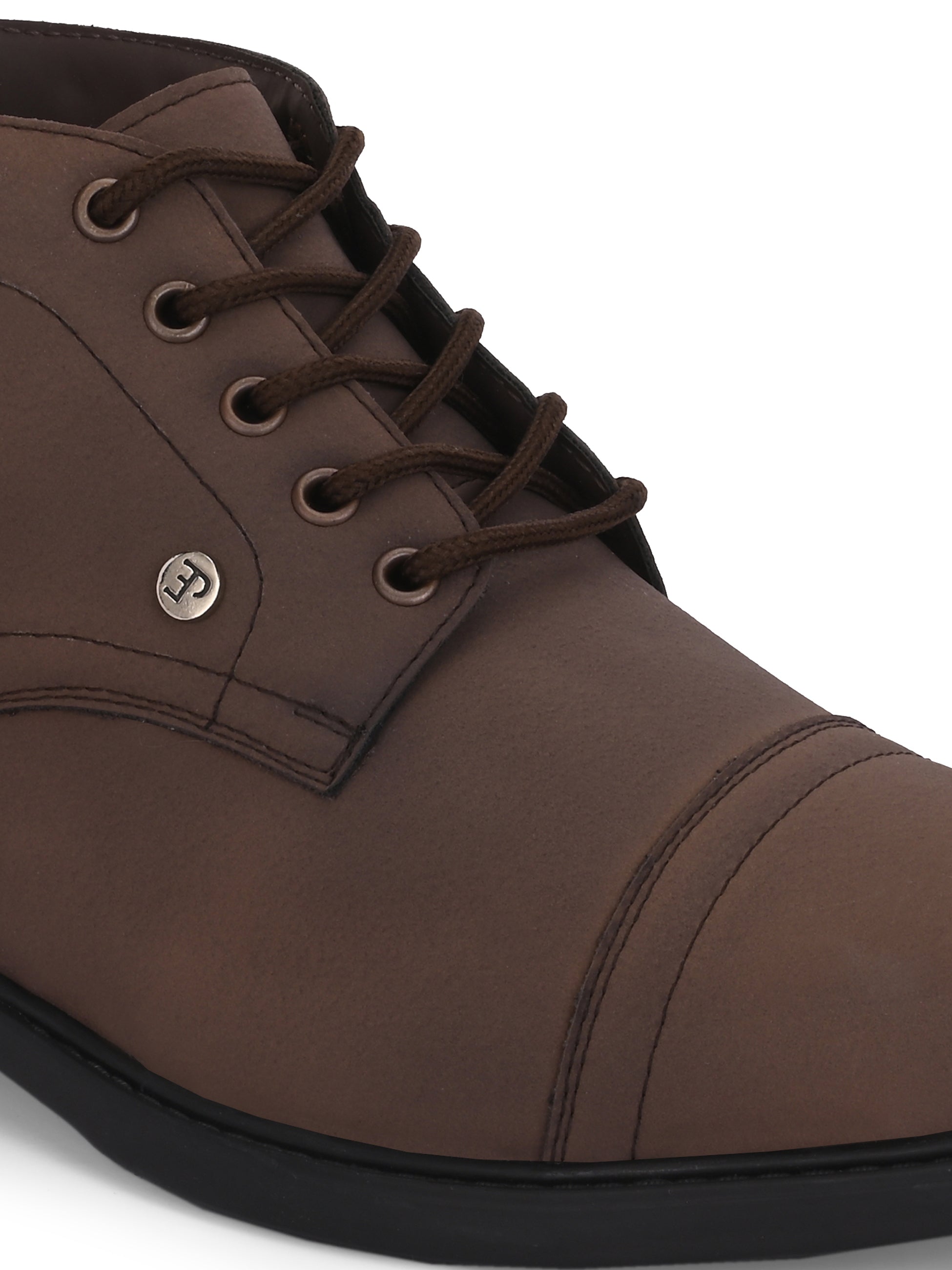 Faux leather casual boots with a cap toe, sleek design, metal eyelets, and a small brand logo near the ankle.