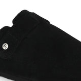 Black suede slip-on clog with a black rubber sole and adjustable strap.