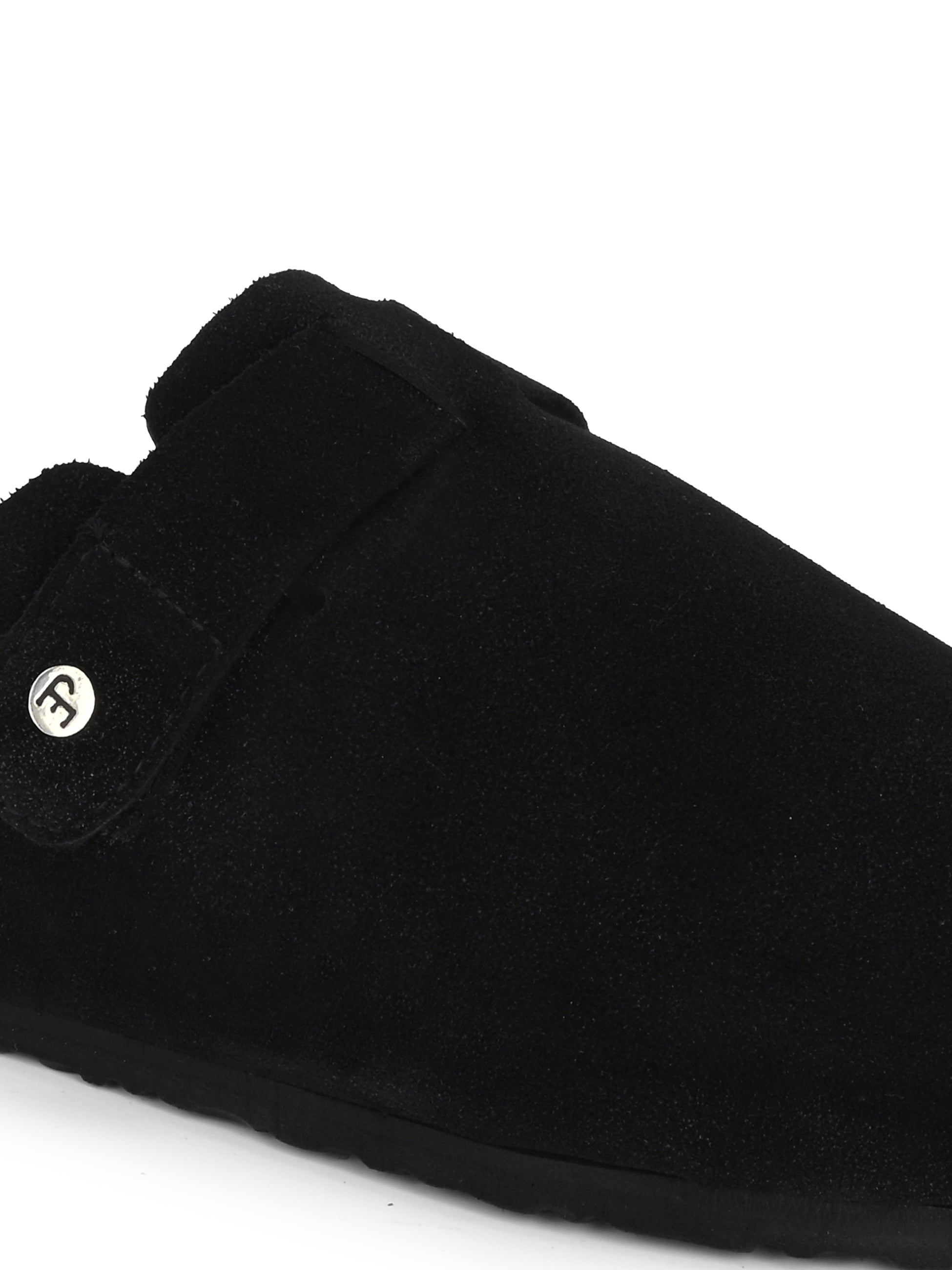 Black suede slip-on clog with a black rubber sole and adjustable strap.