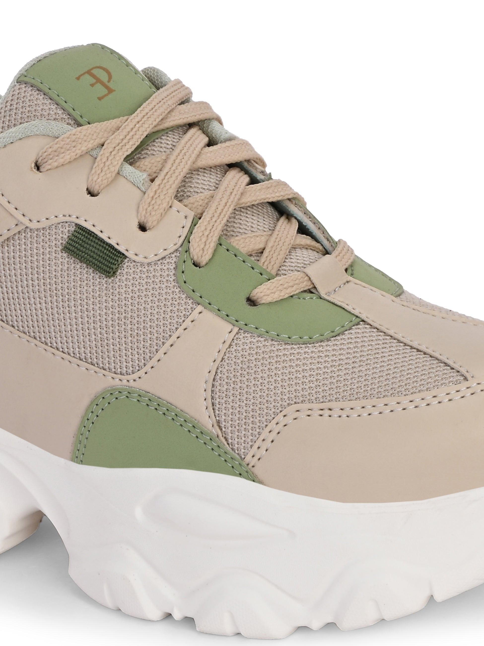Beige and green chunky sneaker with a textured sole and modern design