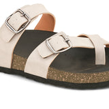 Pink cork-sole sandal with two adjustable straps featuring silver buckles and a casual slip-on design.