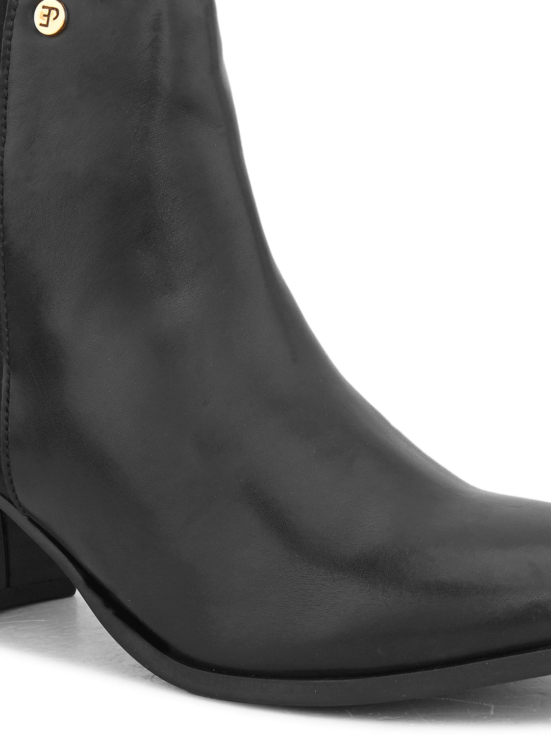 Black ankle boot with a smooth leather front, suede back, block heel, pointed toe with a zip