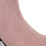 Light pink heigh top boot with a block heel and a sleek, minimalist design.