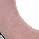 Light pink heigh top boot with a block heel and a sleek, minimalist design.