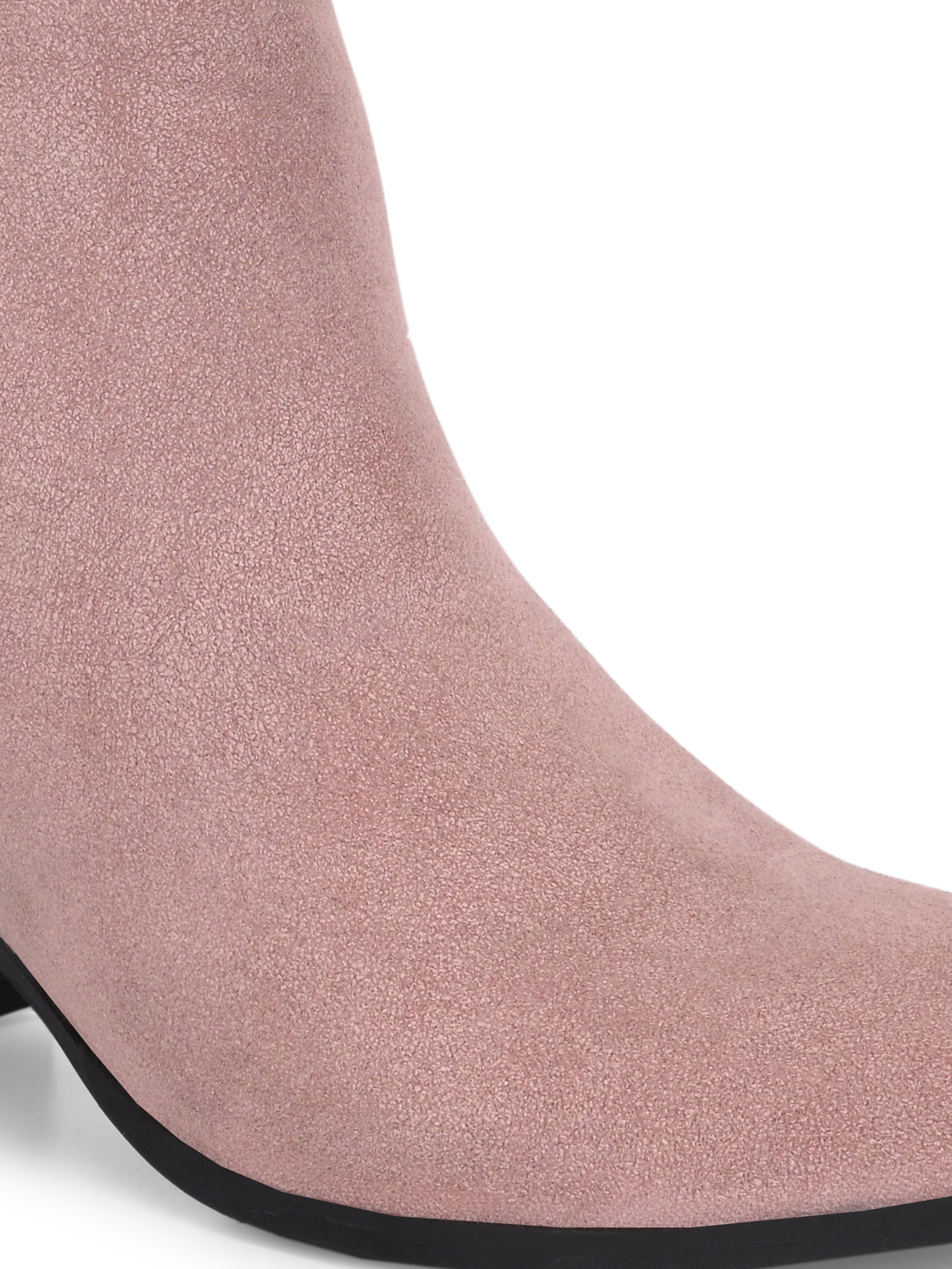 Light pink heigh top boot with a block heel and a sleek, minimalist design.