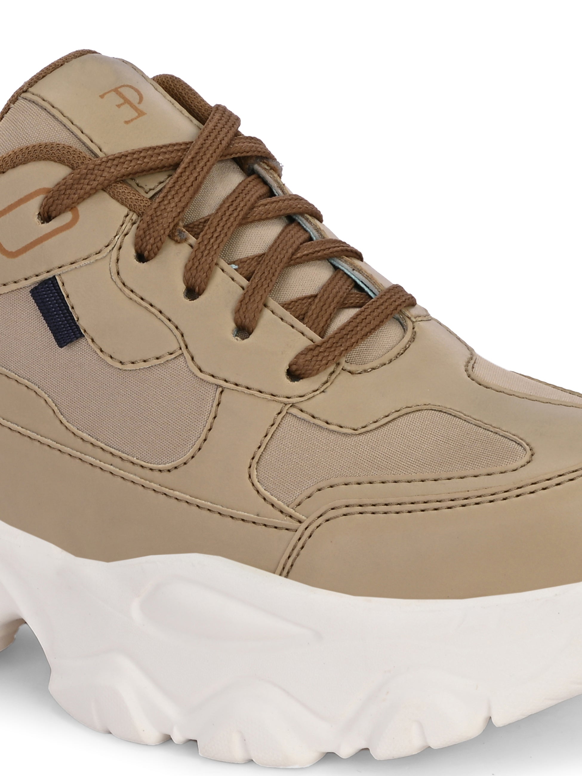Beige sneaker with a textured white sole, brown laces, and modern detailing, designed for casual and stylish wear.