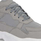 a grey and white sneaker with white heel and lace-up design