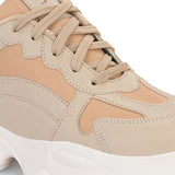 Beige chunky sneakers with a textured sole and mesh accents.