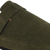 Olive suede slip-on clog with a black rubber sole and adjustable strap.