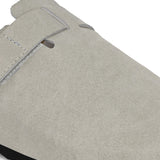 Nude suede slip-on clog with a black rubber sole and adjustable strap.