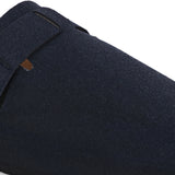 Blue suede slip-on clog with a black rubber sole and adjustable strap.