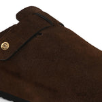 Brown suede slip-on clog with a black rubber sole and adjustable strap.