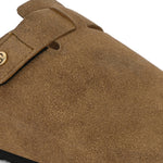 Olive suede slip-on clog with a black rubber sole and adjustable strap.