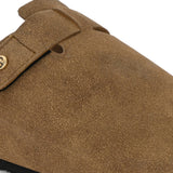 Olive suede slip-on clog with a black rubber sole and adjustable strap.