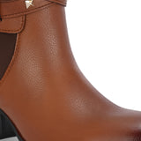 Brown leather ankle boots with studded straps and a buckle design.