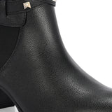 Black leather ankle boots with studded straps and a buckle design.