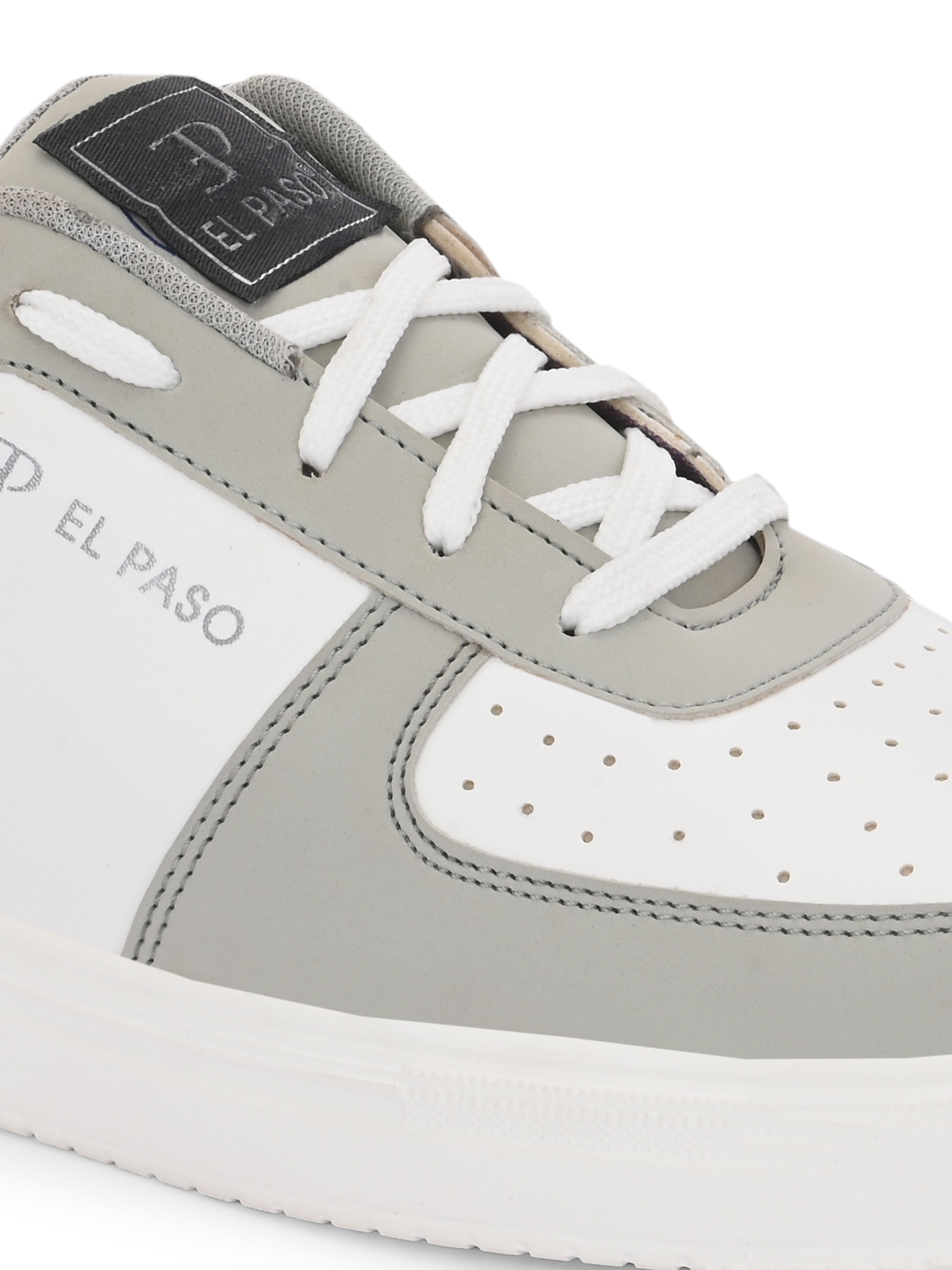 A white and grey sneaker featuring a sleek design and a clean white sole, perfect for casual wear.