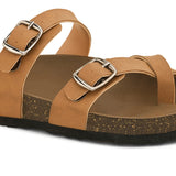 Brown cork-sole sandal with two adjustable straps featuring silver buckles and a casual slip-on design.