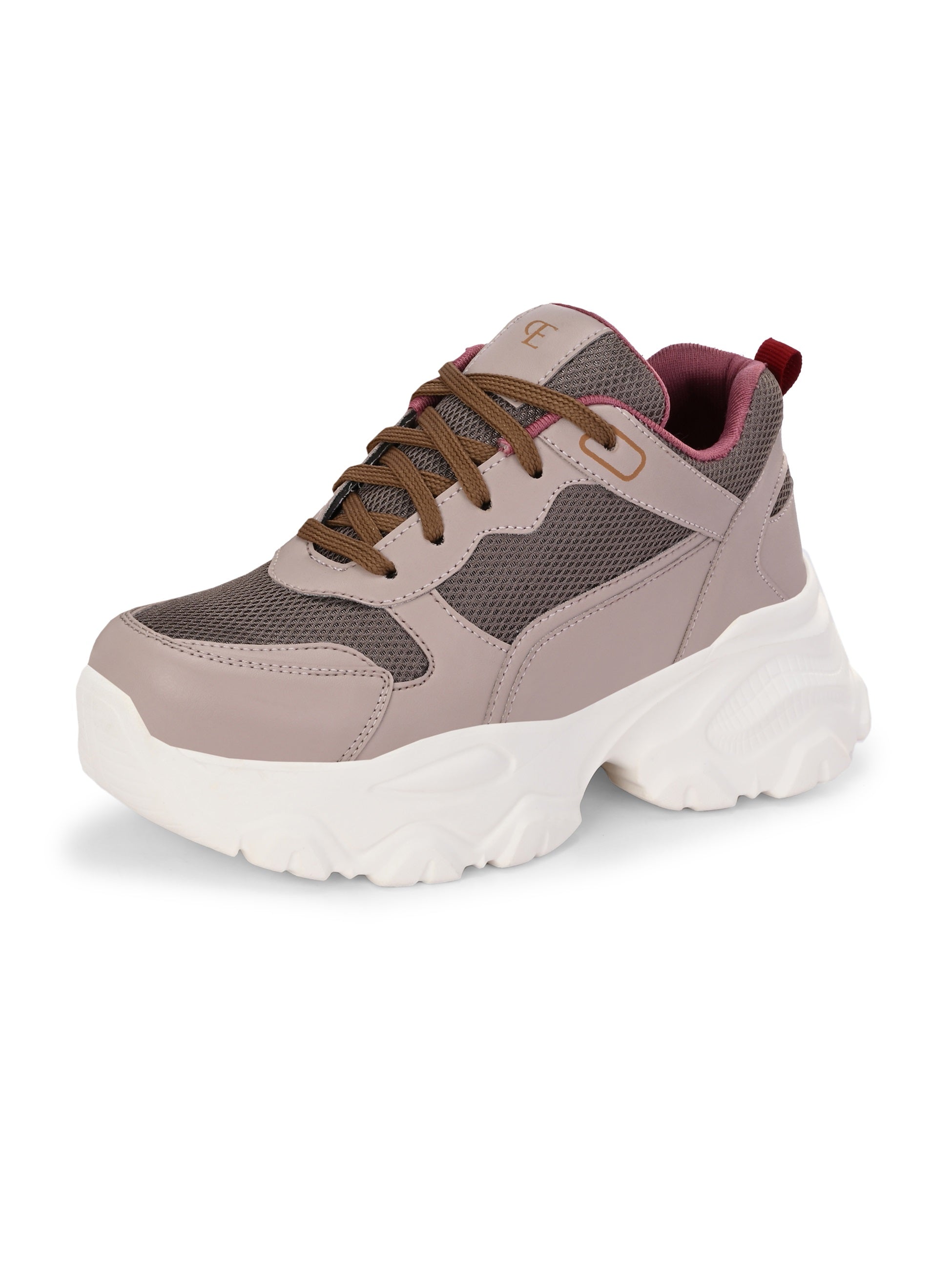 A chunky sneaker with a brown mesh upper, pink leather panels, brown laces, and a thick white sole.
