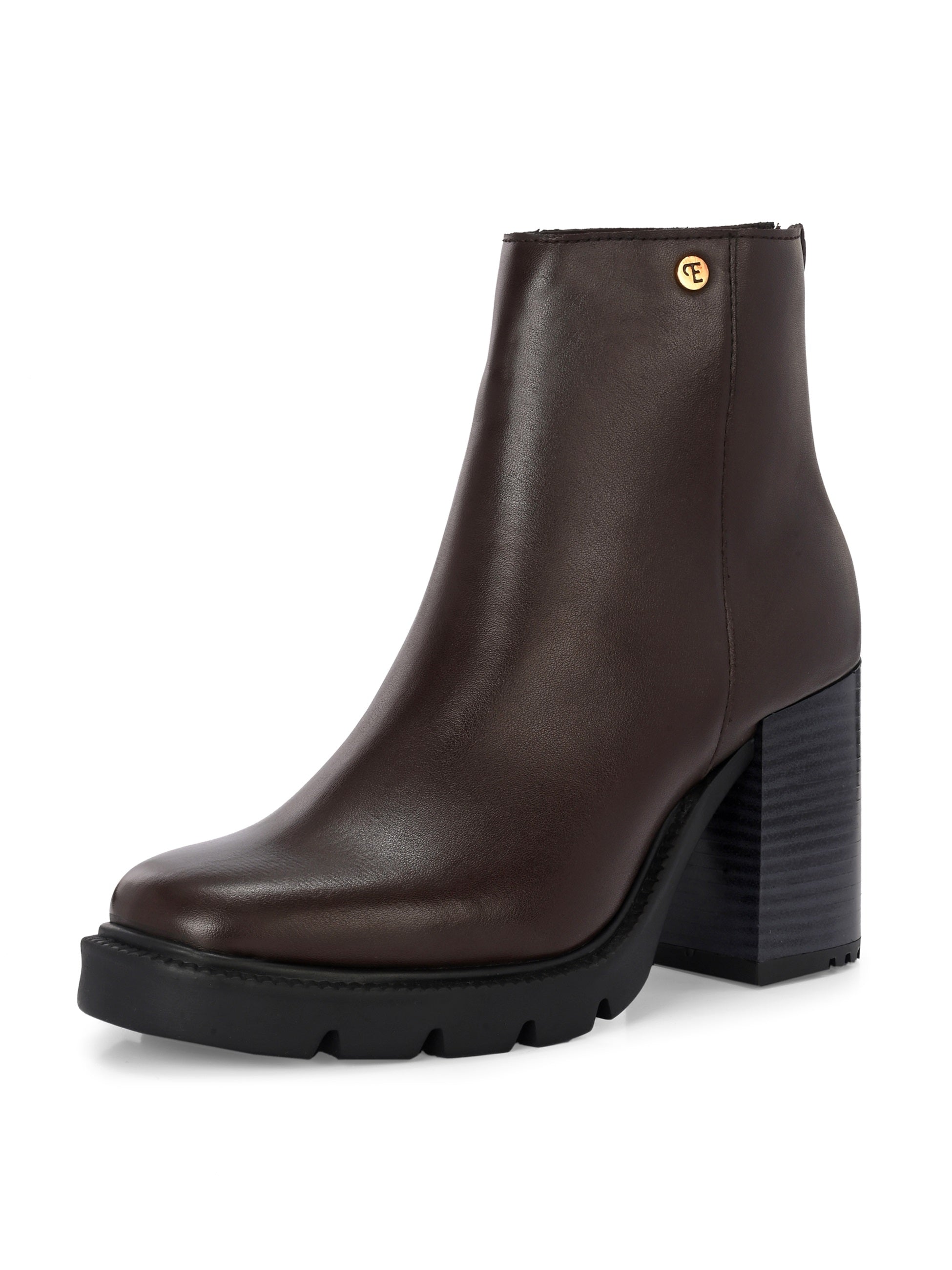 Glossy brown patent leather ankle boot with a chunky block heel, lug sole, and a gold logo detail near the collar.