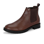 Brown Chelsea boots with elastic side panels, a pull-tab at the heel, rounded toe, and a small metallic brand logo near the ankle.