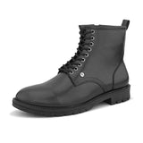 A sleek black patent leather Chelsea lace-up boot with a side zipper, pull-tab at the back, and a low block heel.