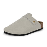 Nude suede slip-on clog with a black rubber sole and adjustable strap.