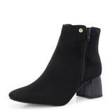 Suede ankle boot with pointed toe, chunky block heel, side zipper, and gold logo detail near the top.