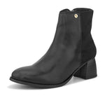 Black ankle boot with a smooth leather front, suede back, block heel, pointed toe with a zip