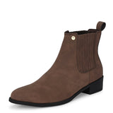 Brown suede slip-on boots with ribbed elastic panels, a pull-tab, and a low block heel for a stylish, comfortable fit.
