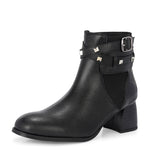 Black leather ankle boots with studded straps and a buckle design.