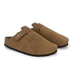 Beige suede slip-on clog with a black rubber sole, adjustable strap, and Boston Soft Footbed for enhanced comfort and support.
