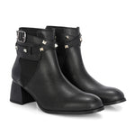 Women Black studded leather ankle boots with studded straps and a buckle design.