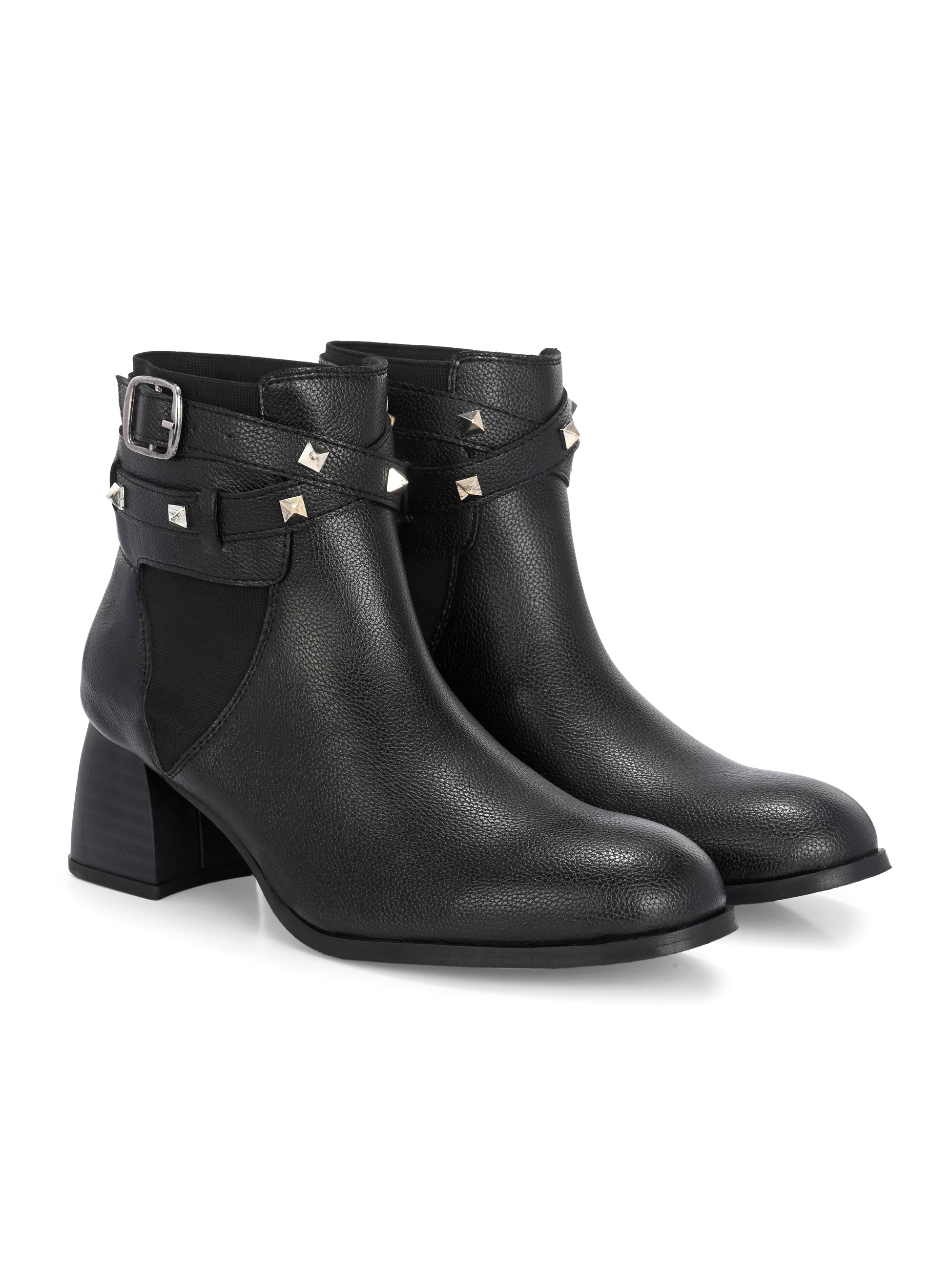 Women Black studded leather ankle boots with studded straps and a buckle design.
