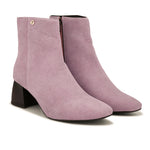Suede Ankle Boots with a sleek design and block heel, paired with pink Faux Leather Boots for Women.