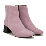 Suede Ankle Boots with a sleek design and block heel, paired with pink Faux Leather Boots for Women.