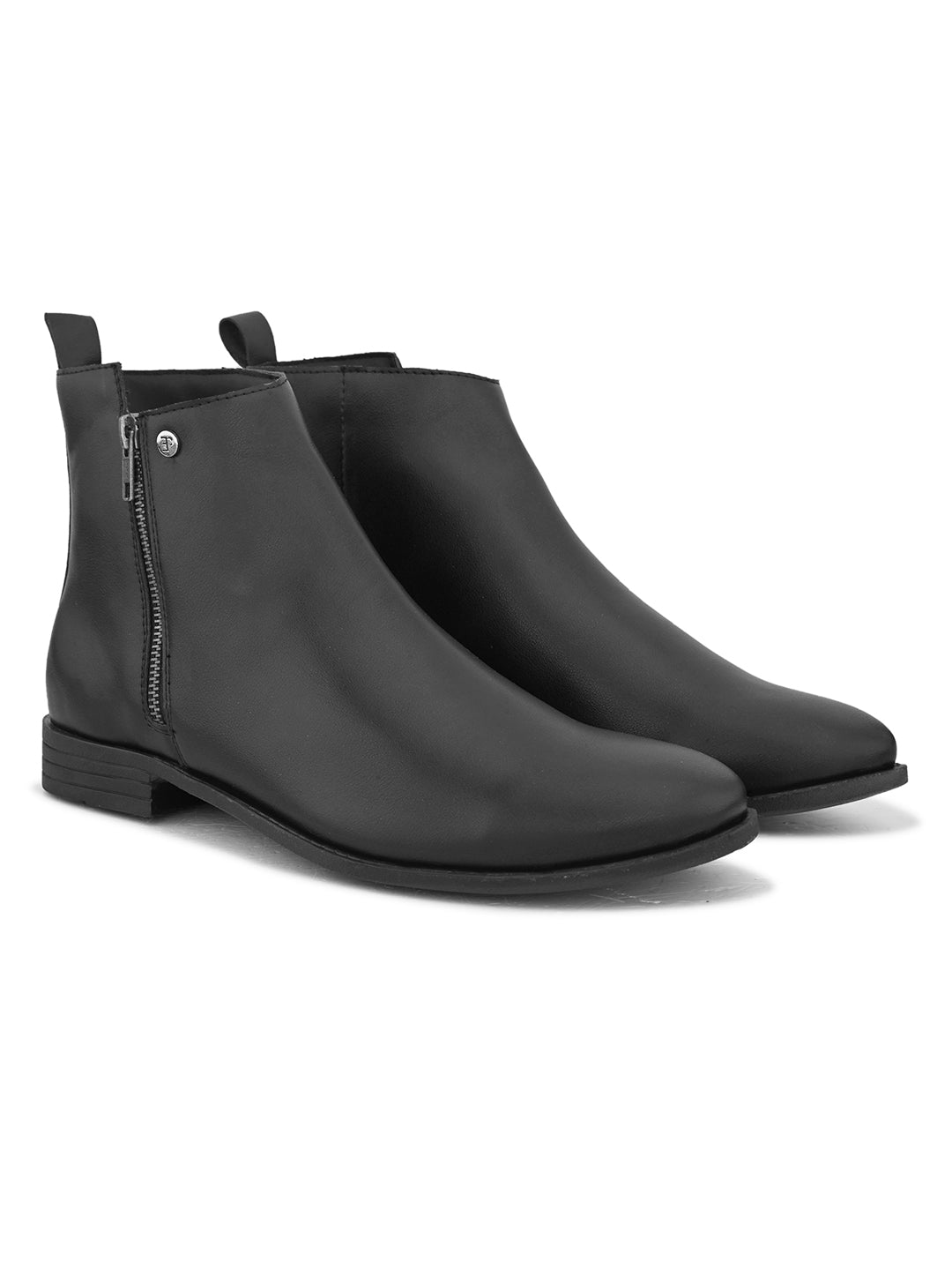 A sleek black leather Chelsea boots with a side zipper, pull-tab at the back, and a low block heel.