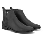 A sleek black leather Chelsea boots with a side zipper, pull-tab at the back, and a low block heel.