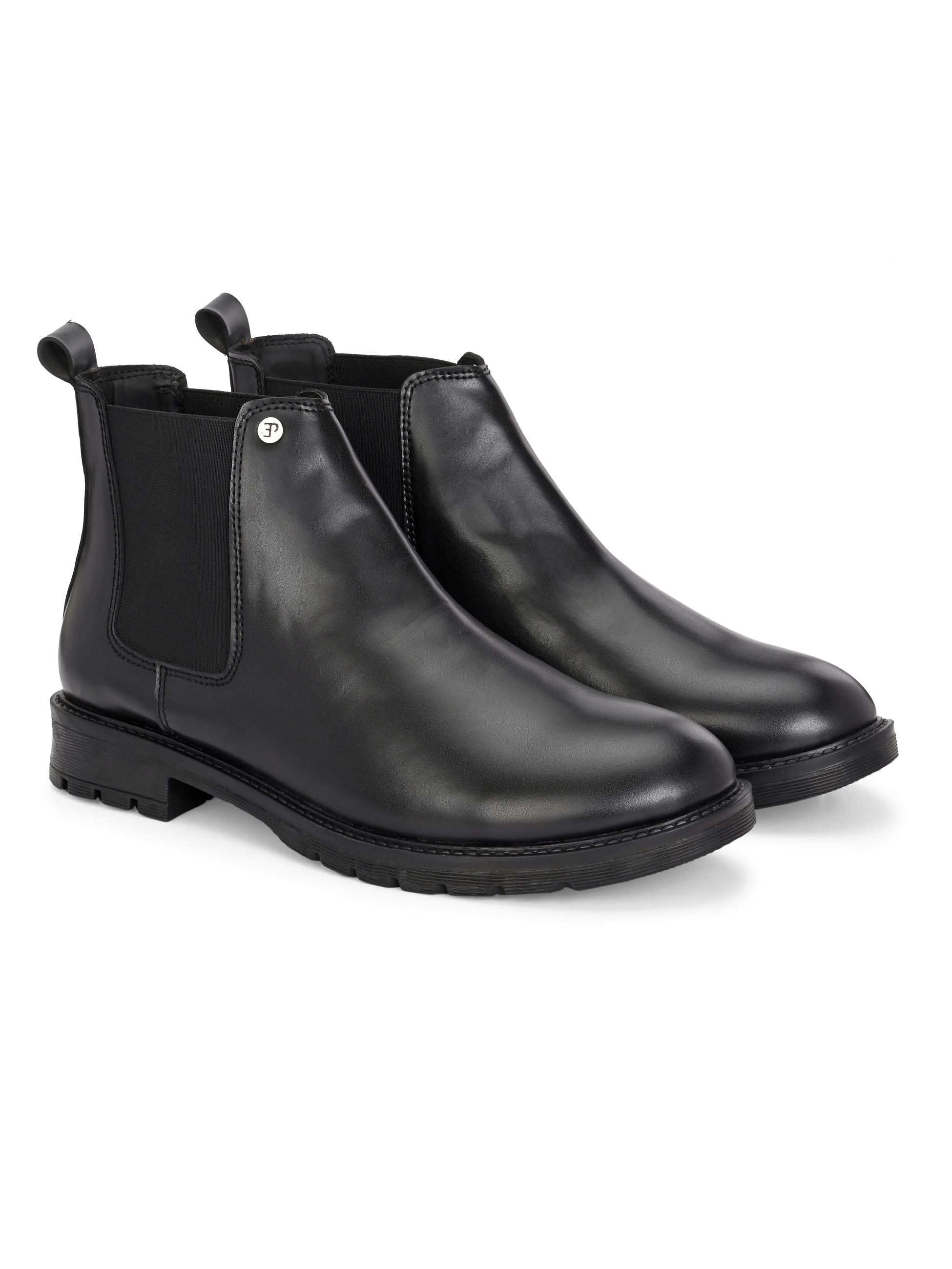 Black leather Classic Chelsea boot with elastic side panels, pull-tab at the heel, rounded toe, and a small metallic brand logo near the ankle.