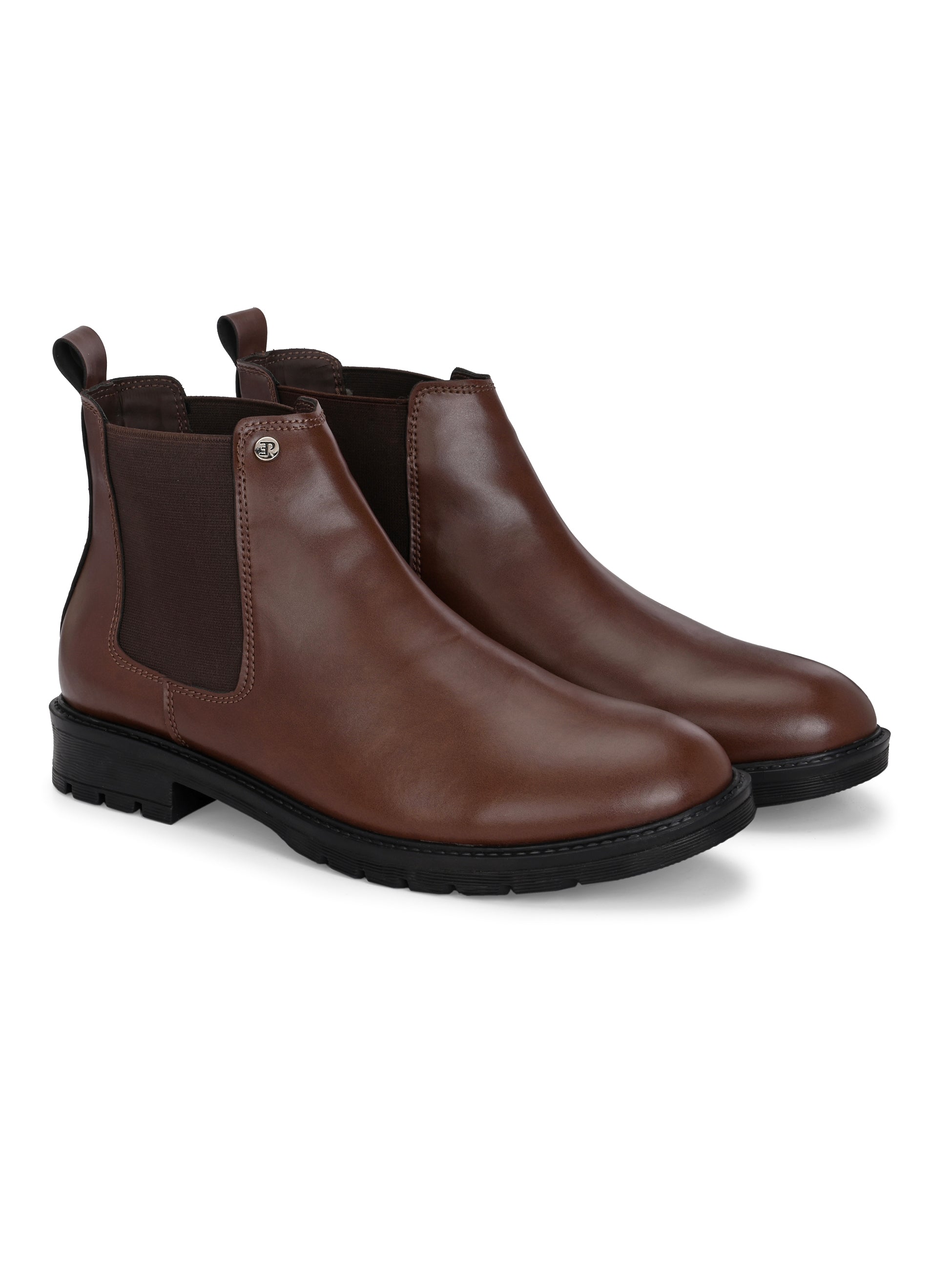 Black leather Classic Chelsea boot with elastic side panels, pull-tab at the heel, rounded toe, and a small metallic brand logo near the ankle.