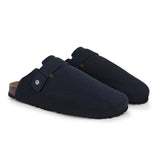 Blue suede slip-on clog with a black rubber sole, adjustable strap, and Boston Soft Footbed for enhanced comfort and support.