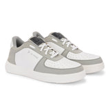 Men Solid Lace-Up Sneakers in white and grey with a sleek design and clean white sole, perfect for casual wear.