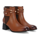 Women brown studded leather ankle boots with studded straps and a buckle design.
