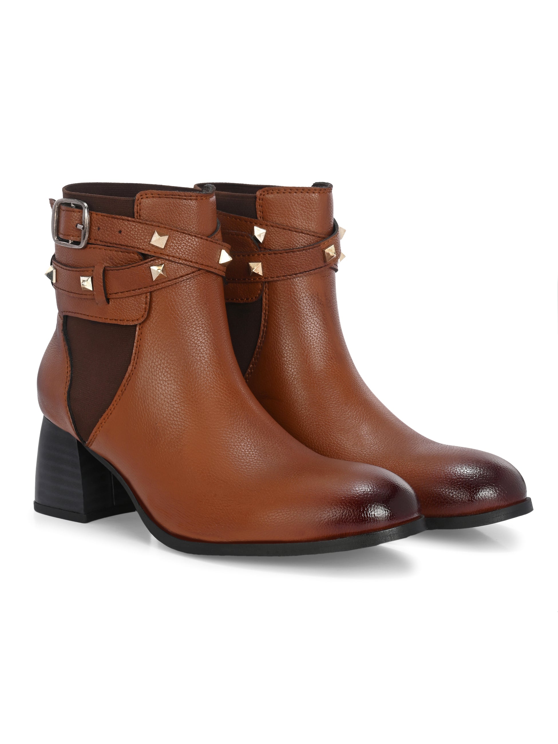Women brown studded leather ankle boots with studded straps and a buckle design.