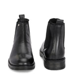 Classic Chelsea boots with elastic side panels, a pull-tab at the heel, rounded toe, and a small metallic brand logo near the ankle.