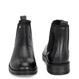 Classic Chelsea boots with elastic side panels, a pull-tab at the heel, rounded toe, and a small metallic brand logo near the ankle.