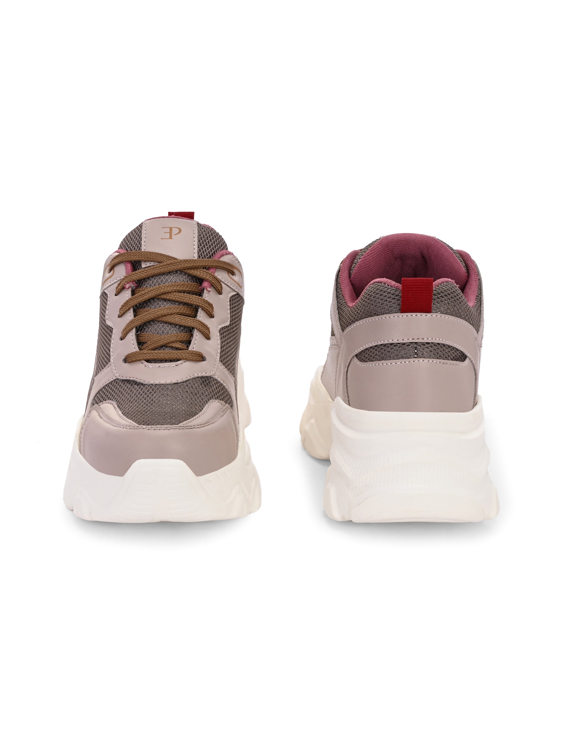 A chunky sneaker with a brown mesh upper, pink leather panels, brown laces, and a thick white sole.